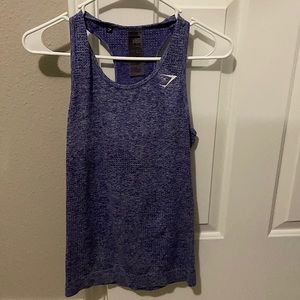 A woman gym shark tank top.